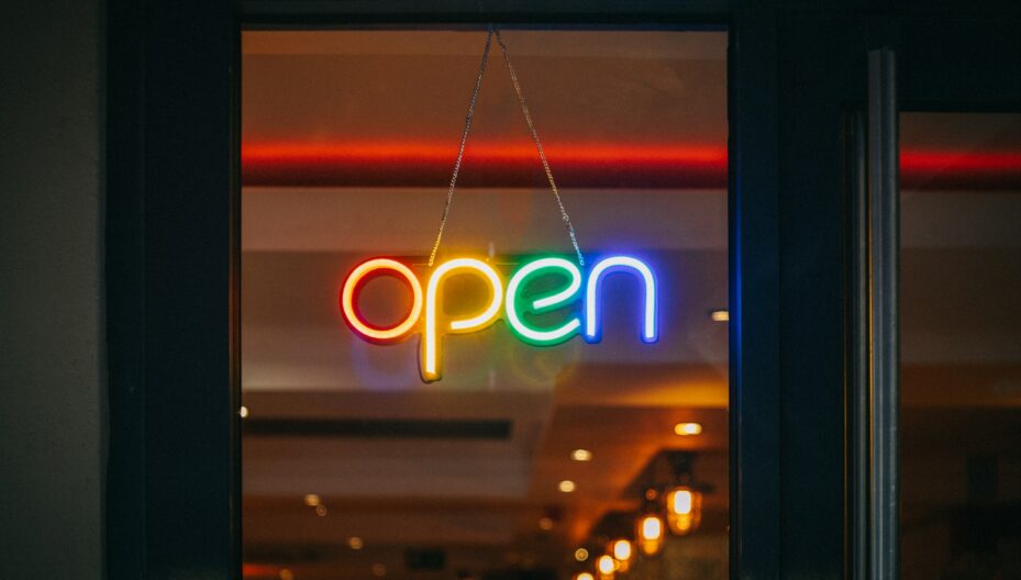 rainbow colored neon open sign